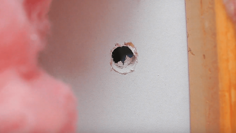 drillied hole to place a security camera system with wires